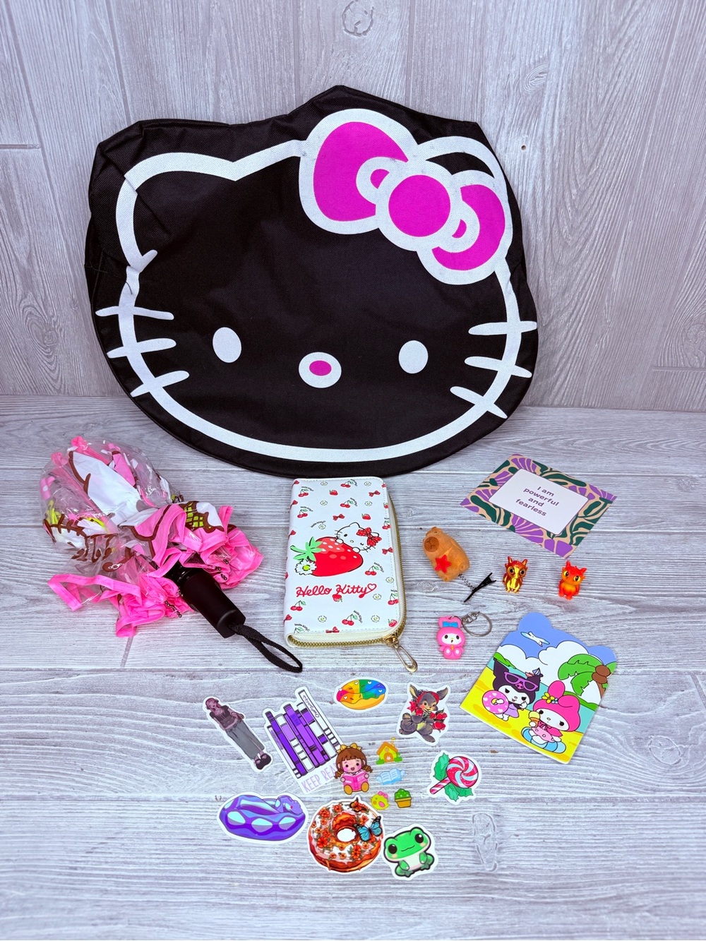 Hello kitty back , wallet , stickers , hair clip , umbrella , paper , keychain